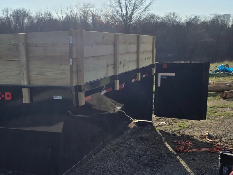 Hurst Earthworks dumpster with the barn-style rear door open