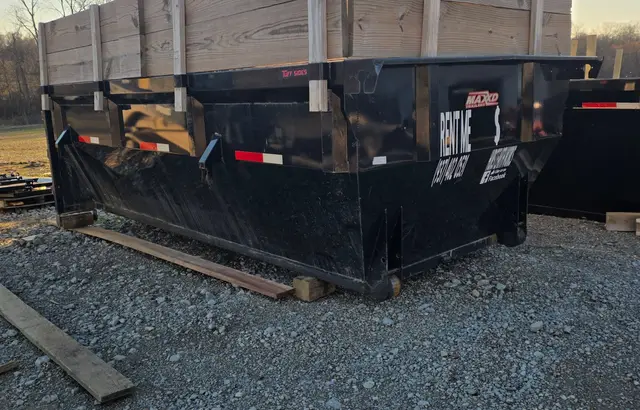 Hurst Earthworks roll-off dumpster with RENT ME sign