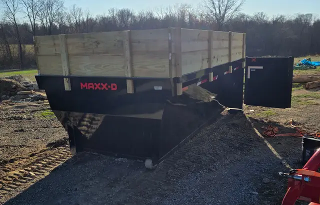 Hurst Earthworks dumpster with open barn-style door for easy loading
